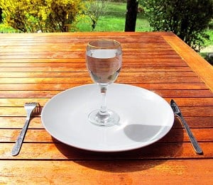 Fasting-a-glass-of-water-on-an-empty-plate