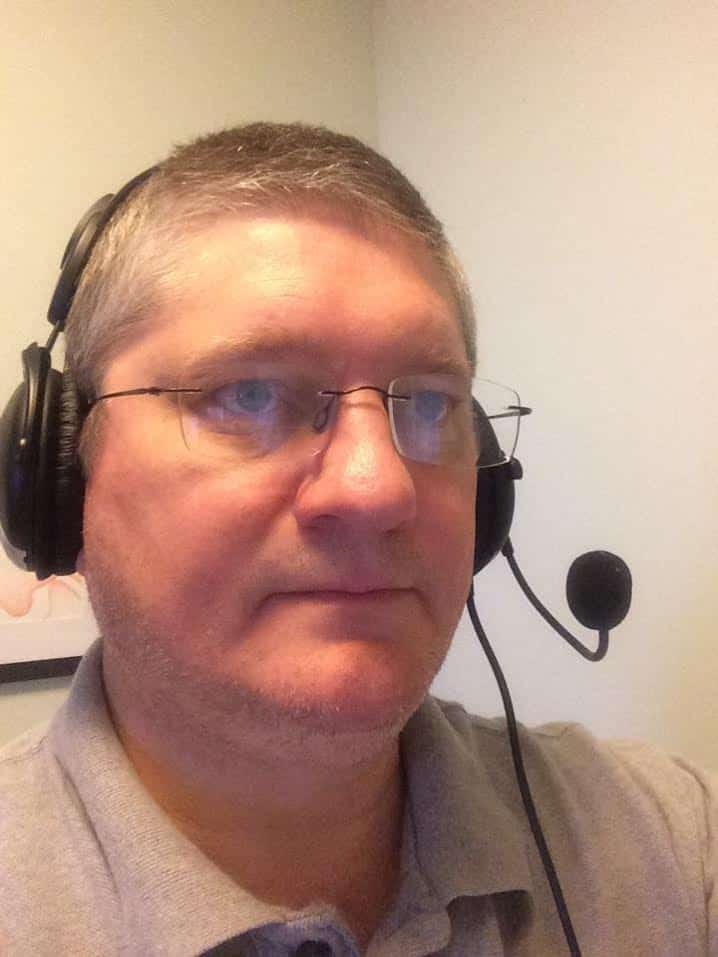 Dr. A with a headset on recording.